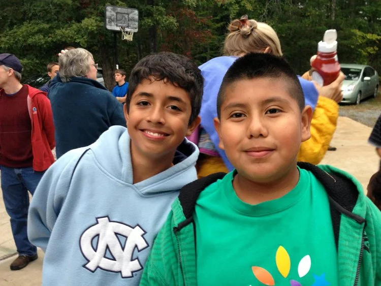 Two boys from the Southwood community smiling at a church cookout